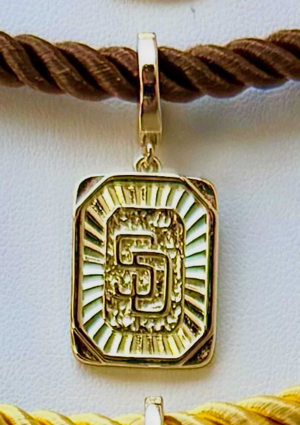 cord collection - sunburst logo